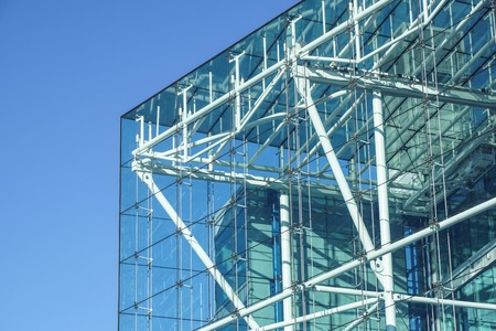 blue building all glass square patern on white sky backgroundの写真素材
