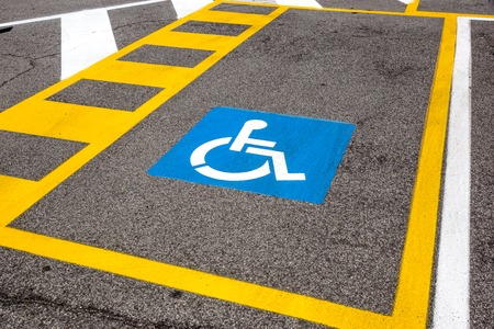 parking space reserved for handicapped shoppers in a retail parking lot.の写真素材