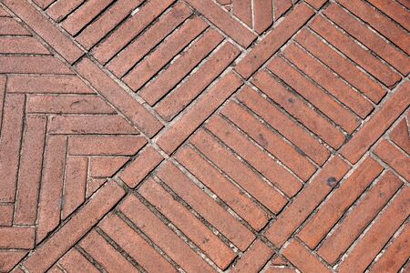 Brick pavement tile, top view. Urban texture as background.