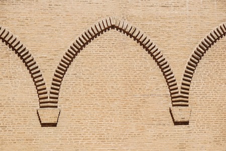 brick wall arch on the castle facadeの写真素材