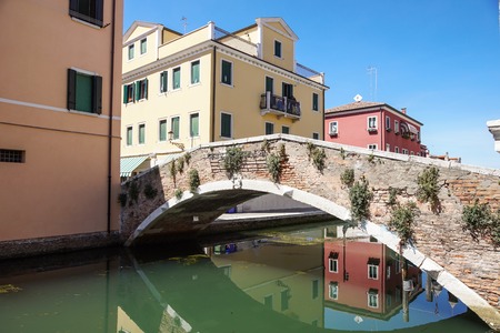 Venice, Italy - 7 july ,2017 : View of the house characteristics of the lagoon of Venice in italy along the canals with moored boats. Venice is the city on the seaのeditorial素材