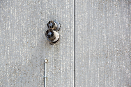 cement wall. minimalism concept. with white air vent hole