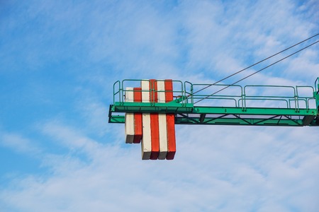crane tower on sky background at construction site .