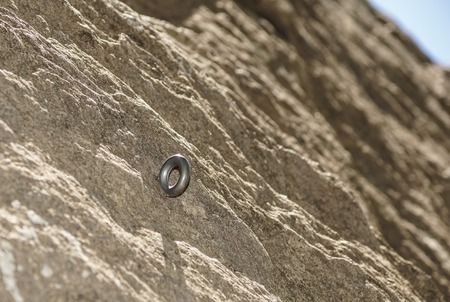 Close up old and dirty rock or stone texture, climbing hook