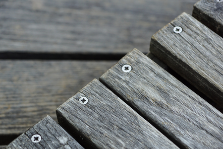 A row of stylish deck chairs . wooden board