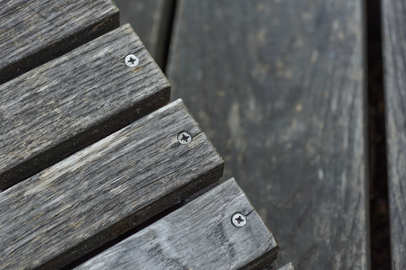 A row of stylish deck chairs . wooden boardの写真素材