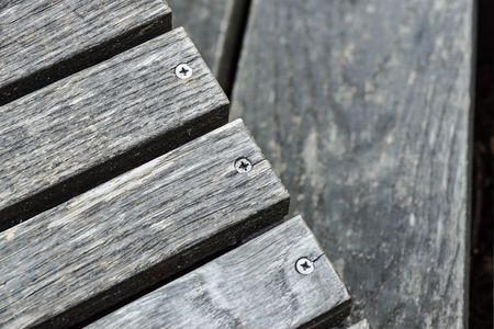 A row of stylish deck chairs . wooden boardの写真素材