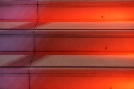 Abstract modern red stairs with warm light - stairway composition .の写真素材