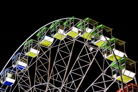 detail of a night-time panorama wheel lit by lights .の写真素材