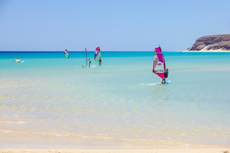 Fuerteventura, Canary Island on June 8th 2017: a group of people are practicing windsurfing. it is necessary to learn using a surf school. This sport is loved and practiced throughout the islandのeditorial素材