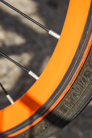 Bicycle wheel old orange color close upの写真素材