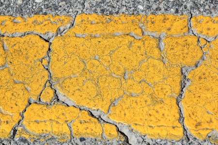 Asphalt road texture with yellow stripeの写真素材