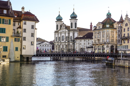 LUCERNE, SWITZERLAND - december 2, 2017: Historic center of Lucerne with view of the dam and bridge on river Reuss. Old Swiss housesのeditorial素材