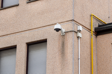 Outdoor bullet CCTV camera on the wall, space for text. Concept - technology and securityの写真素材