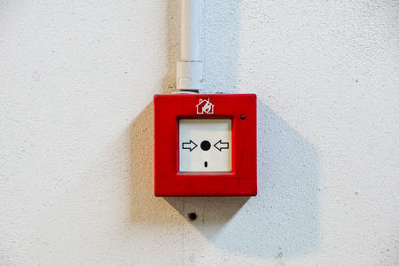 Fire alarm switch on white wallの写真素材
