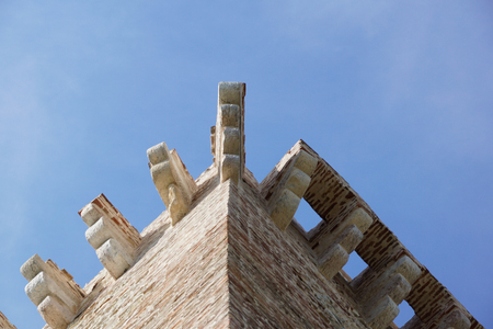 ruins of old medieval castle . fortified wall and tower detail brickの写真素材