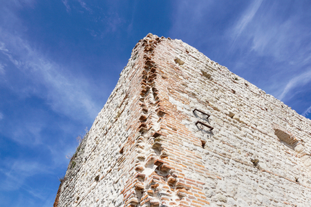 ruins of old medieval castle . fortified wall and tower detail brickの写真素材