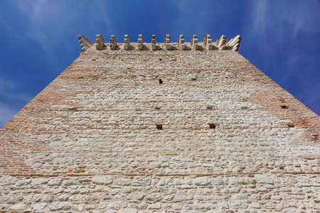 ruins of old medieval castle . fortified wall and tower detail brickの写真素材