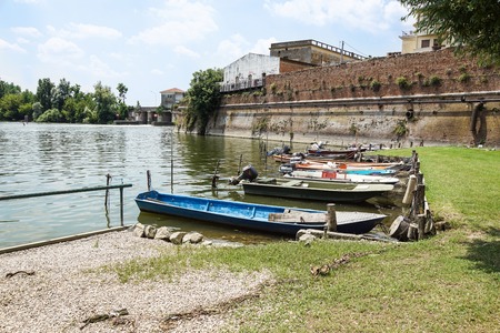 Beautiful autumn sunset landscape. boats moored at wooden pierの写真素材