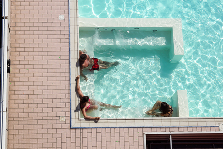 spa in hot tub . people are relaxing at the poolside. relaxing in swimming pool spa. people is relaxing in the pool.Relax spaの写真素材