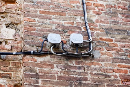 cable electrical on outdoor wall .lectrical boxes and lots of electrical wires connecting