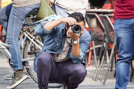 MILANO ITALY , 13 .MARCH 2019 : photografer make a photo of tourists in a new finantial district