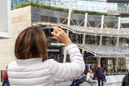 MILANO ITALY , 13 .MARCH 2019 : photografer make a photo of tourists in a new finantial district