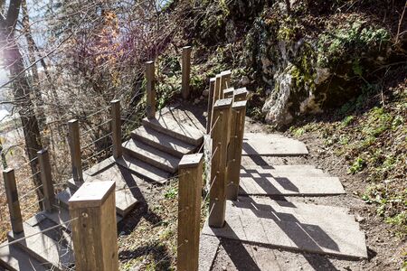 stairway on side of a mountain with wooden handrailの写真素材