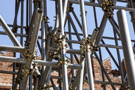 Scaffolding pipe clamp and parts, An important part of building strength to scaffold clamps in used close up on construction site,platforms for stage structure support .の写真素材