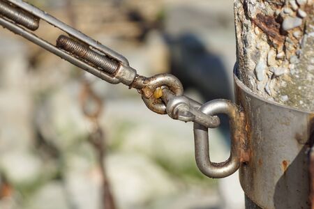 stainless steel turnbuckle hook and steel wire cable rope connection ties and connections concept. bracing and securing conceptの写真素材