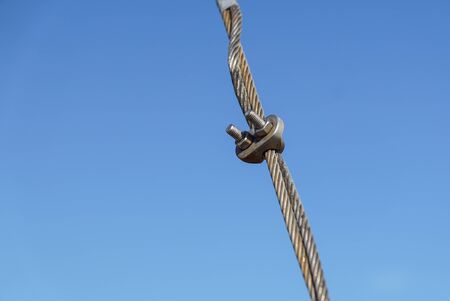 Cable steel wire and metal clamp a part of bridge structure.の写真素材