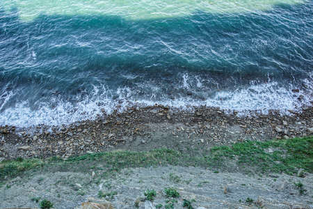 Rocks in the ocean, viewed from aboveの写真素材