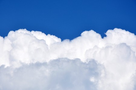 A beautiful white cloud on a blue winter skyの写真素材