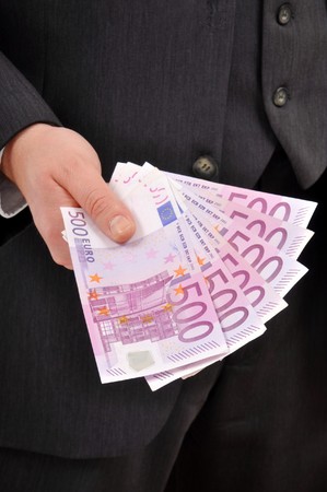 Business man is paying with euro banknotes, financial backgroundの写真素材
