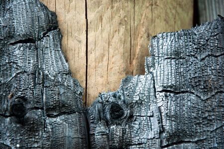 Dark, burned marks on an old batten, wood textureの写真素材