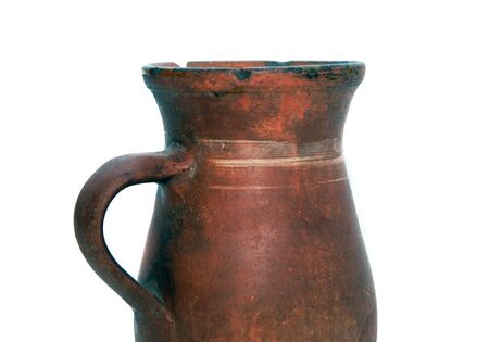 Old, obsolete clay pot on a white background, studio photo.の写真素材