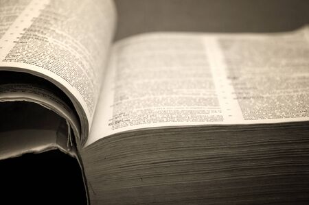 Massive open book close up detail, warm light.の写真素材