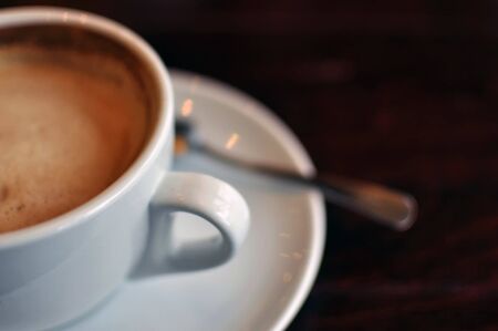 Cup of coffee with shallow depth of field in low light condition.の写真素材