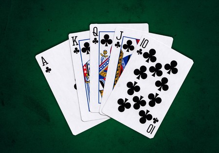 Royal Flush of Spades over a green grungy background