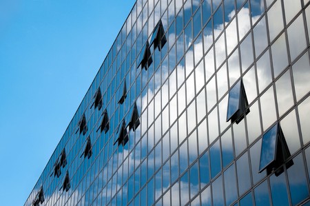corporate office building with large, glass windowsの写真素材