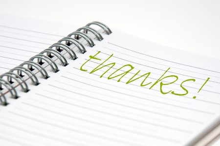 handwritten note in a notebook, close up imageの写真素材