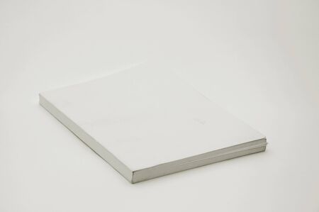 Blank white cover book over a white backgroundの写真素材
