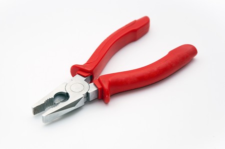 Hand tool, red combined pliers over a white background.