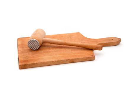 Wooden meat hammer on kitchen board isolated on white background.の写真素材