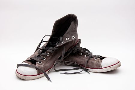 pair of old, dirty gray sneakers の写真素材