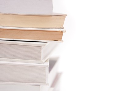 Stack of books over a white backgroundの写真素材