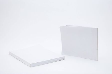 Blank white cover book over a white backgroundの写真素材