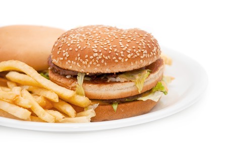 A tasty hamburger, cheeseburger and french fries.の写真素材