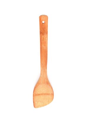 A spoon made of wood over a white backgroundの写真素材