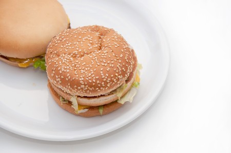 A tasty hamburger and cheeseburger on a plate.の写真素材